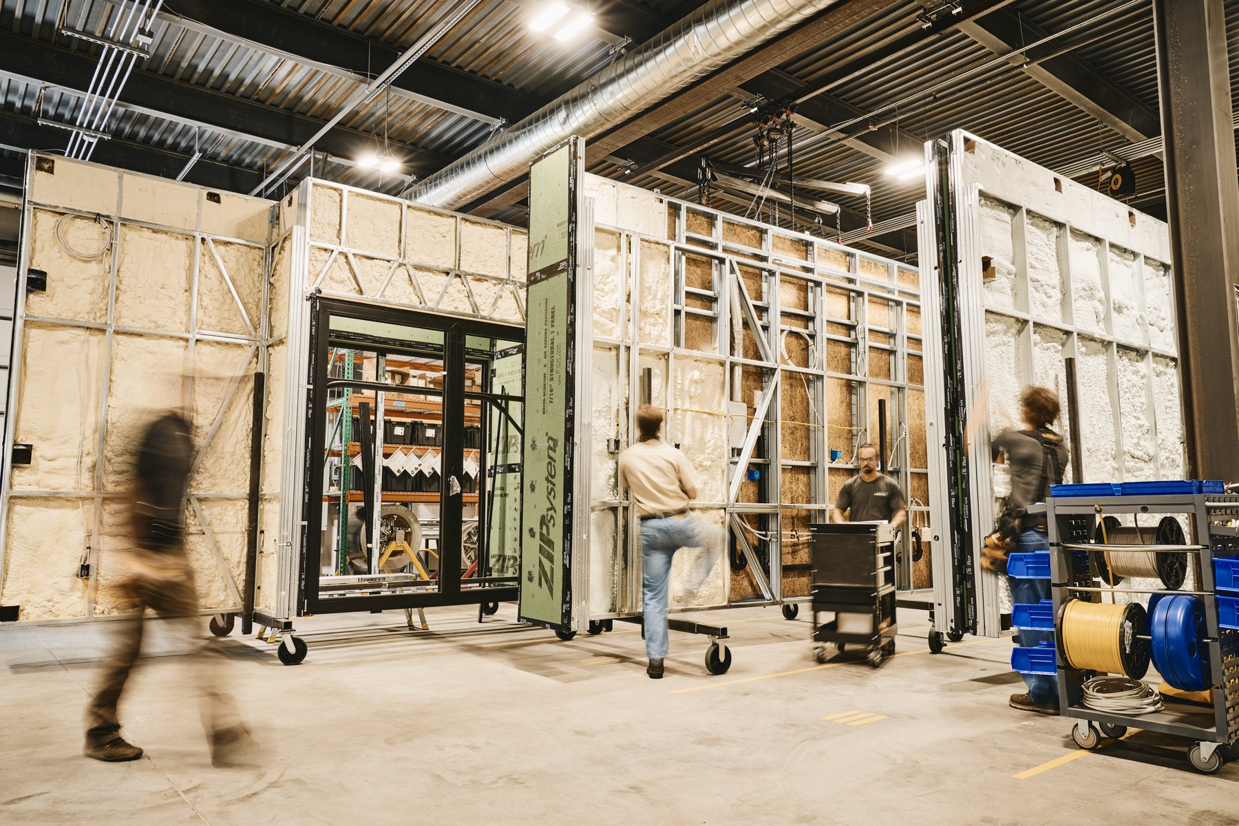 Crew assembling wall panels in the factory